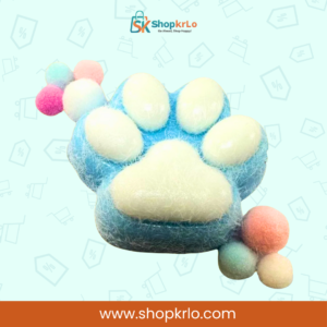 Blue cat paw squishy toy held in hand showing comfortable grip.