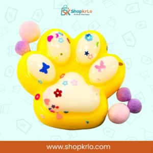 Bright Yellow Paw Squishy Toy held in hand showing 5cm x 6cm size.