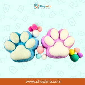 Soft cat paw fidget squeezed in hand showing slow rebound texture