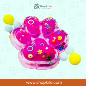 Vibrant pink paw squishy toy held in hand to show size