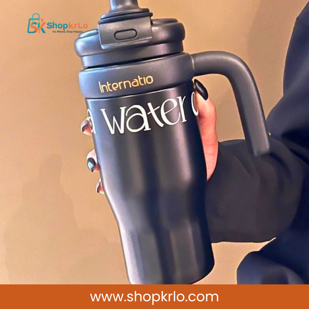 Hand holding black insulated tumbler for convenient daily hydration in Pakistan